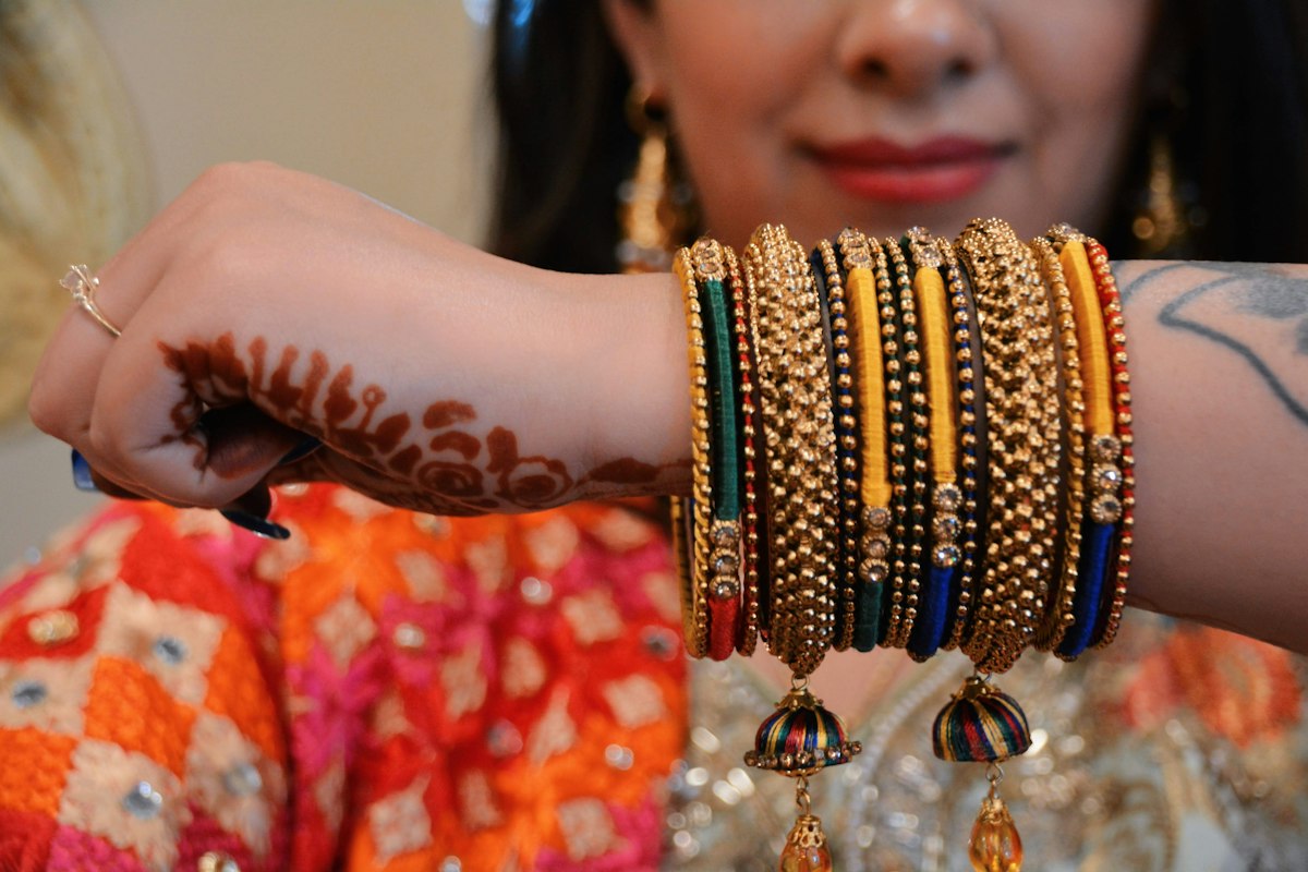 Silk thread bangles with jhumka latkans worn on a wrist